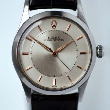 1957 Rolex Oyster Perpetual "Bullseye" Mint 100% Original Condition with Rose Gold Hour Markers and Dauphine Hands. Rolex Flat-Sided Case Ref. 6532. Cal. 1030