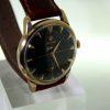 1960 Geneve Solid Gold Case 30MM Movement Rare Omega Factory Black Original Dial with Cross-Hairs and Applied Solid Gold Arrowhead Hour Markers and Dauphine Hands Original Omega Signed Winding Crown