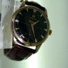 1960 Geneve Solid Gold Case 30MM Movement Rare Omega Factory Black Original Dial with Cross-Hairs and Applied Solid Gold Arrowhead Hour Markers and Dauphine Hands Original Omega Signed Winding Crown
