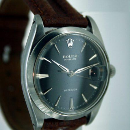 1961 Oysterdate All Steel with Original Black and Silver Rolex Signed Dial with Early Dagger-Style Rolex Hands Silver Hour Markers and Rolex Signed Oyster Screw-Down Crown. Rolex Manual Wind Movement