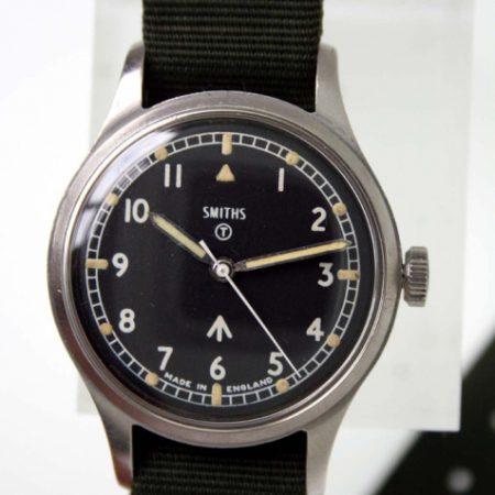 1969 British Army Military Issued Wristwatch Ref. W10/6645 with Hacking Seconds and Broadarrow and Military Markings on Case-Back. Superb Example on Black Military Strap