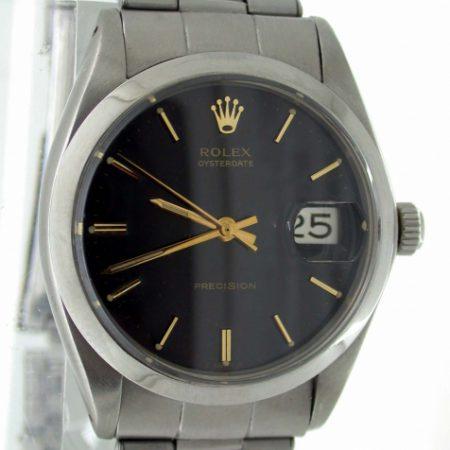 1969 Oysterdate Ref. 6694 with Gloss Black and Gilt Original Rolex Dial. Rolex Signed Oyster Screw Down Crown. Original 1960's Mint Condition Rolex Steel Bracelet