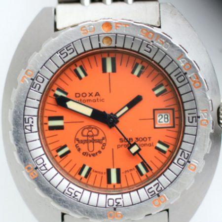 1970s Doxa Sub300T Professional Desigend by Jacques Cousteau with Orange Dial with US Divers Co LogoThis Watch comes on its Original Divers Extention Bracelet