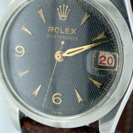 Rare 1956 Mid-Sized Oysterdate Precision Ref. 6466 with Black and Gilt "Waffle" Dial and Rare Alternating Red/Black "Roulette" Date Wheel