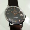 Vintage 1960s New Old Stock "NOS" Automatic Seamaster Calendar De Ville with Original Grey Dial with Bronze Hour Markers. Never Been Used on NOS Matching Omega Strap and Vintage Buckle